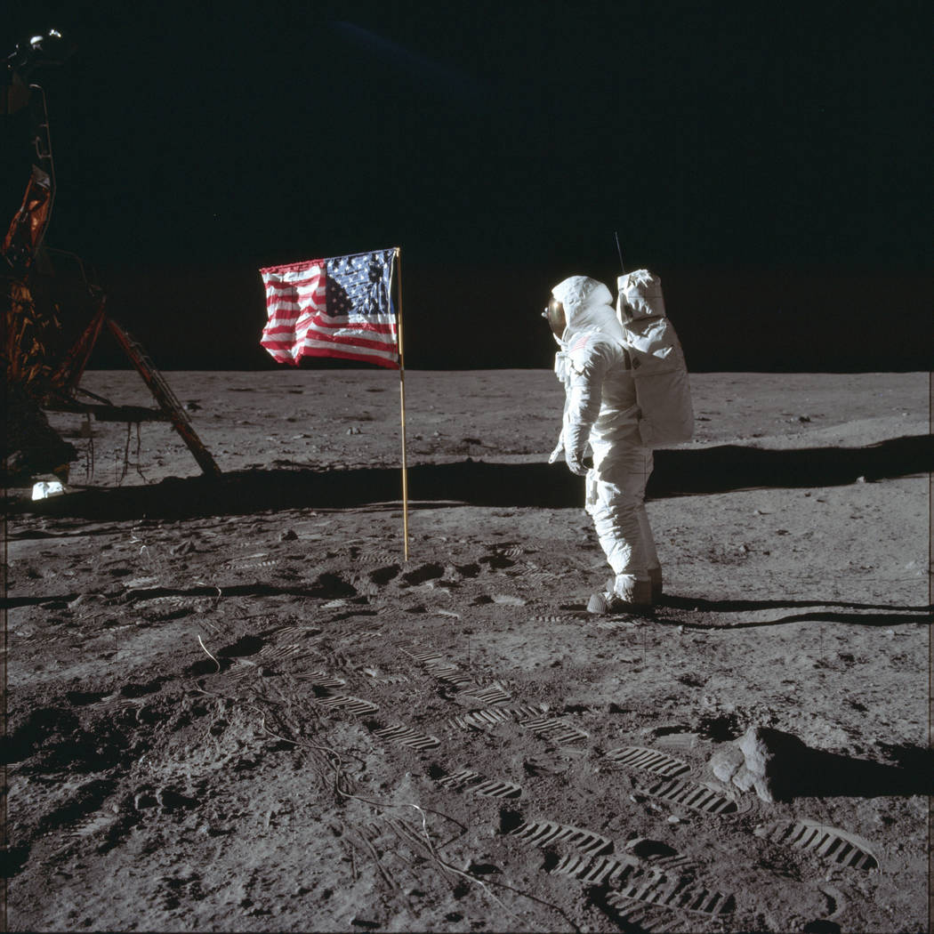 Astronaut Buzz Aldrin Jr. poses for a photograph beside the U.S. flag on the moon during the Ap ...