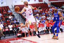 Croatia's Zeljko Sakic (33) jumps to keep the ball in as Detroit Pistons' Bruce Brown (6) looks ...