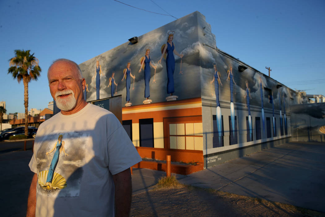James Stanford with part of his mural, "A Phalanx of Angels Ascending" on the 705 Building at 7 ...