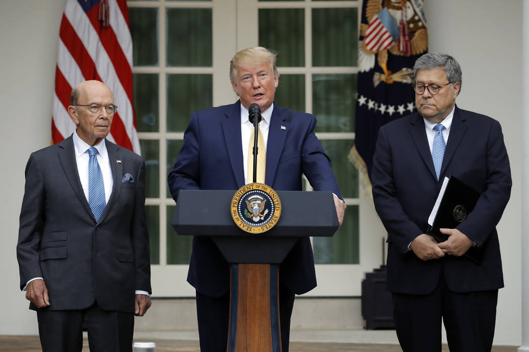President Donald Trump is joined by Commerce Secretary Wilbur Ross, left, and Attorney General ...