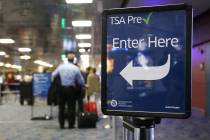 Passengers wait in a Transportation Security Administration Precheck screening line at Terminal ...