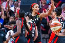 Las Vegas Aces forward A'ja Wilson celebrates a win with teammates after their overtime victory ...