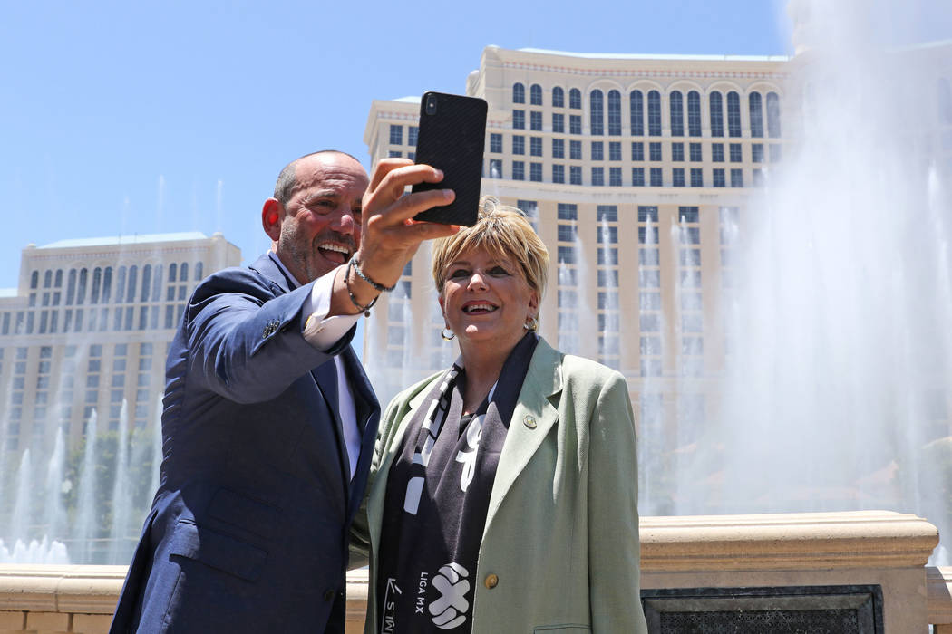 Major League Soccer Commissioner Don Garber, left, and Las Vegas Mayor Carolyn Goodman take a s ...