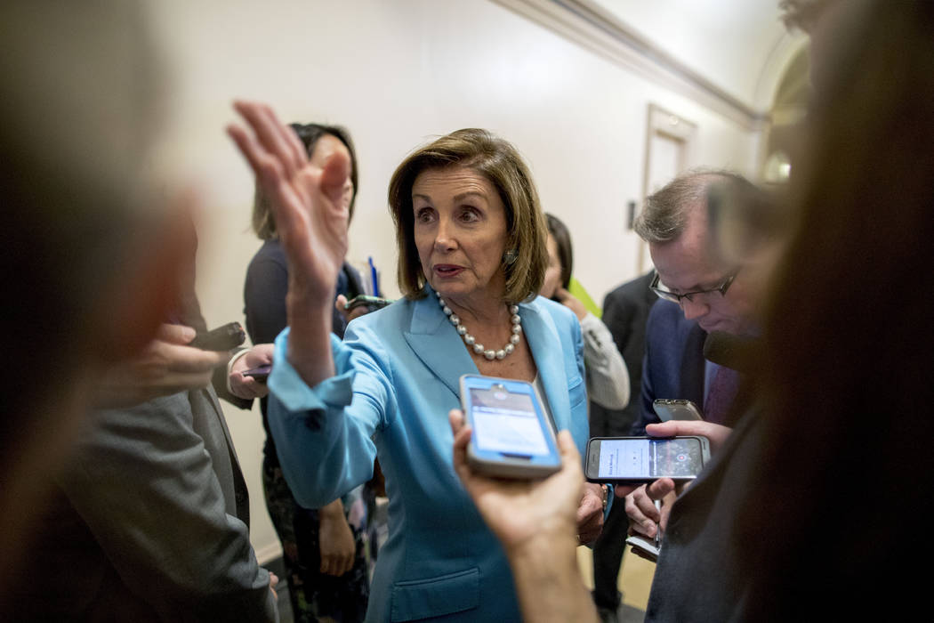 House Speaker Nancy Pelosi of Calif. speaks to reporters following a House Democratic caucus me ...