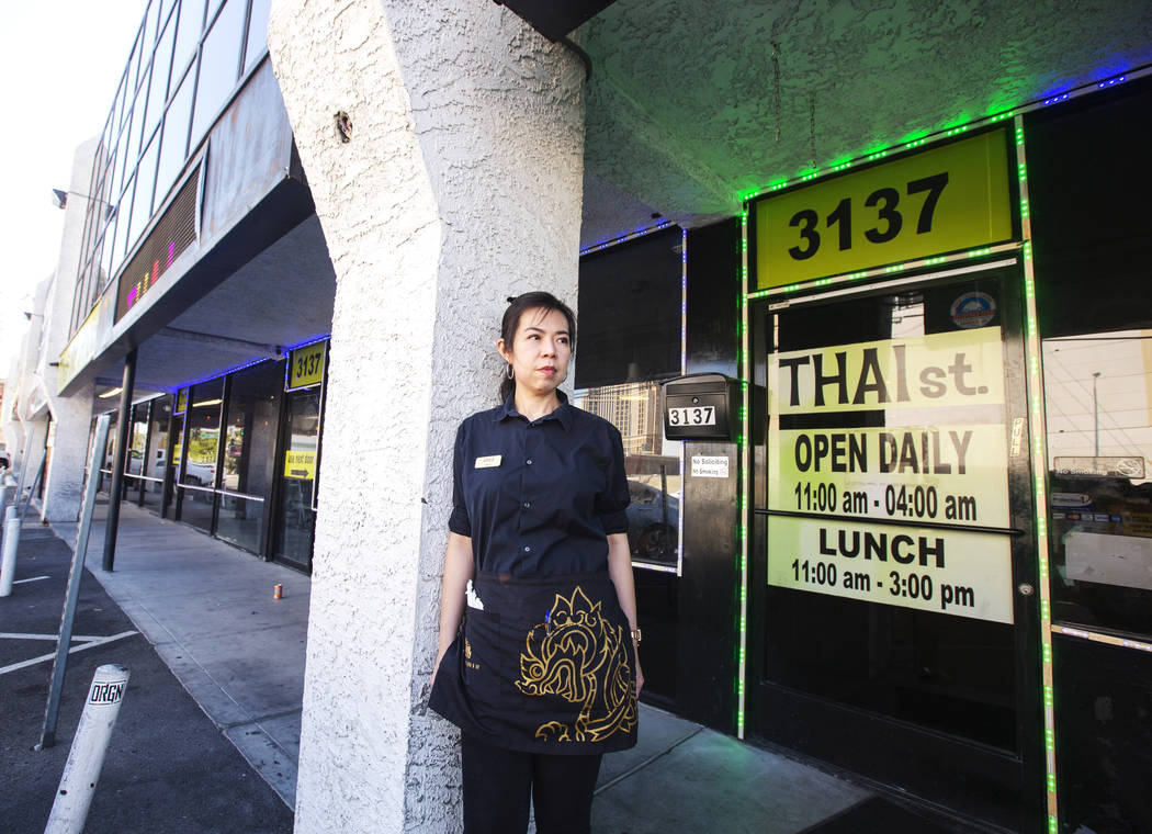 Apple Mollette takes a portrait outside of her job at the Thai St. restaurant at Siegel Plaza W ...