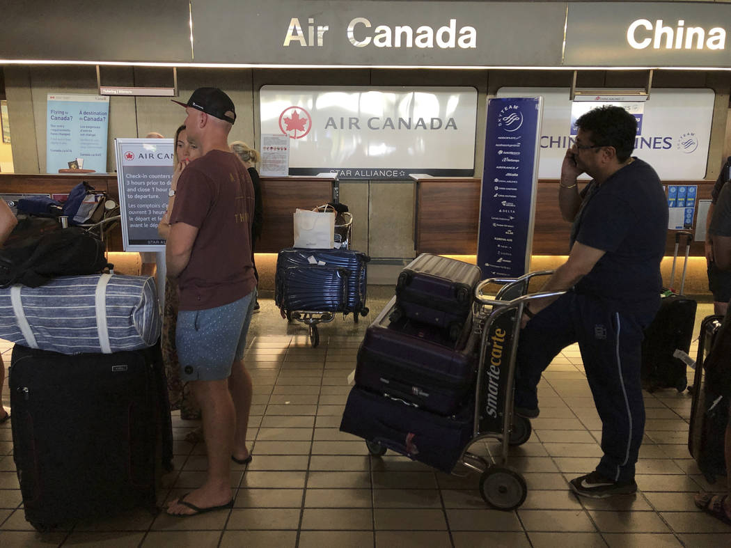 Passengers from an Australia-bound Air Canada flight diverted to Honolulu Thursday, July 11, 20 ...