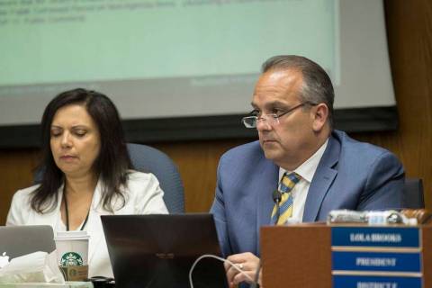 Clark County School Superintendent Dr. Jesus Jara, right, listens to public comments during a m ...
