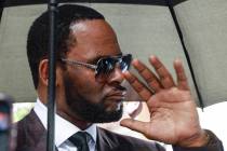 In a June 26, 2019, file photo, Musician R. Kelly departs from the Leighton Criminal Court buil ...