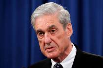 In a May 29, 2019, file photo, Special counsel Robert Mueller speaks at the Department of Justi ...