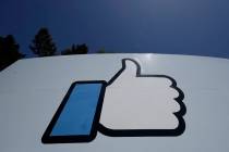 An April 25, 2019, file photo shows the thumbs-up "Like" logo on a sign at Facebook headquarter ...