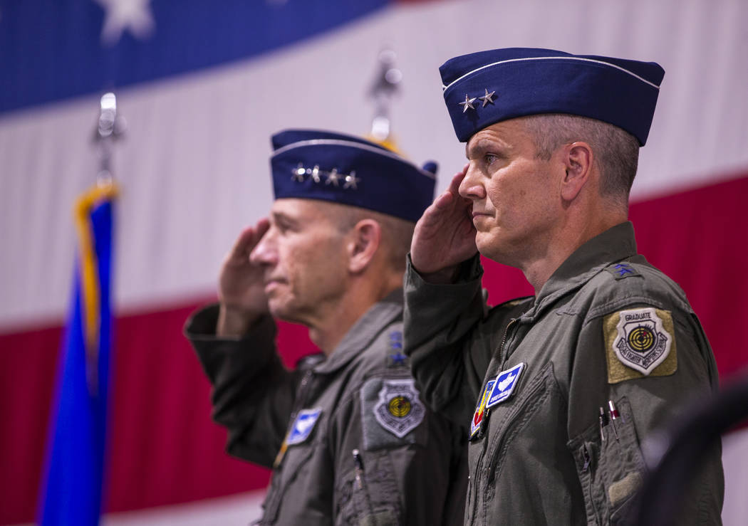 Maj. Gen. Charles Corcoran, right, and Gen. Mike Holmes, Commander of Air Combat Command, salut ...