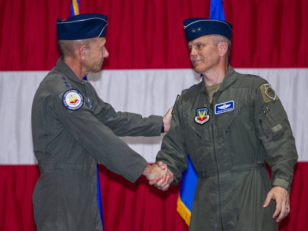 Gen. Mike Holmes, Commander of Air Combat Command, left, and Maj. Gen. Charles Corcoran shake h ...