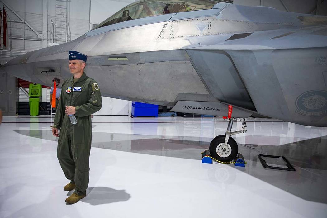 Maj. Gen. Charles Corcoran stands next to his fighter jet after he assumed command of the U.S. ...