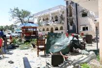 A view of Asasey Hotel after an attack, in Kismayo, Somalia, Saturday July 13, 2019. At least ...