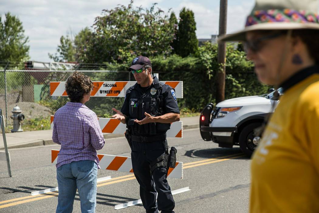 Police Officer Sam Lopez turns away would-be protesters in front of a road block near the North ...
