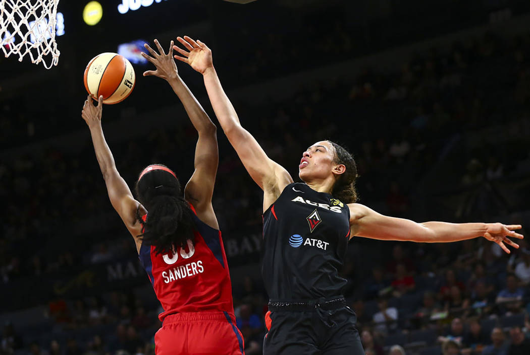 Washington Mystics forward LaToya Sanders (30) blocks a shot from Las Vegas Aces forward Dearic ...