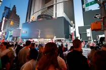 Screens in Time Square are black during a widespread power outage, Saturday, July 13, 2019, in ...