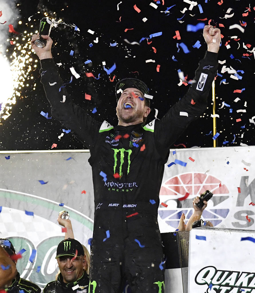 Kurt Busch celebrates his win in the NASCAR Cup Series auto race at Kentucky Speedway in Sparta ...