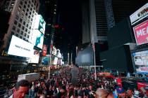 Screens in Times Square are black during a power outage, Saturday, July 13, 2019, in New York. ...