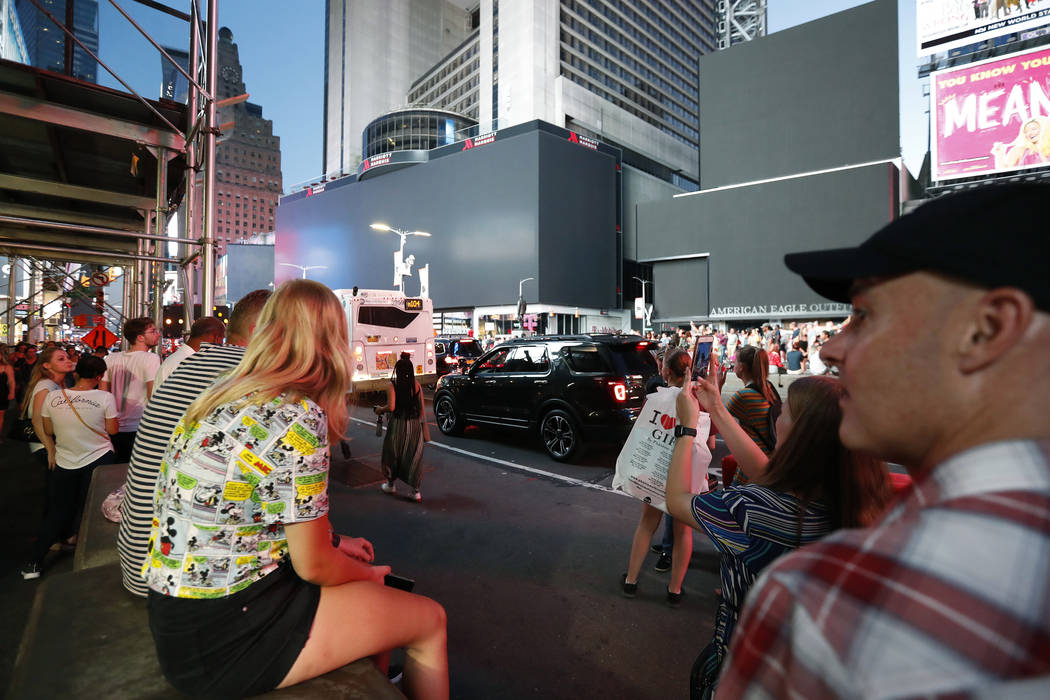 Screens in Times Square are black during a widespread power outage, Saturday, July 13, 2019, in ...