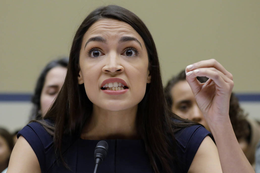 Rep. Alexandria Ocasio-Cortez, D-NY., gestures while testifying before the House Oversight Comm ...
