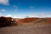 Observatories and telescopes sit atop Mauna Kea, Hawaii's tallest mountain and the proposed con ...