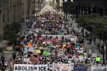 Thousands of people, including immigrants and their supporters, rally against President Trump's ...
