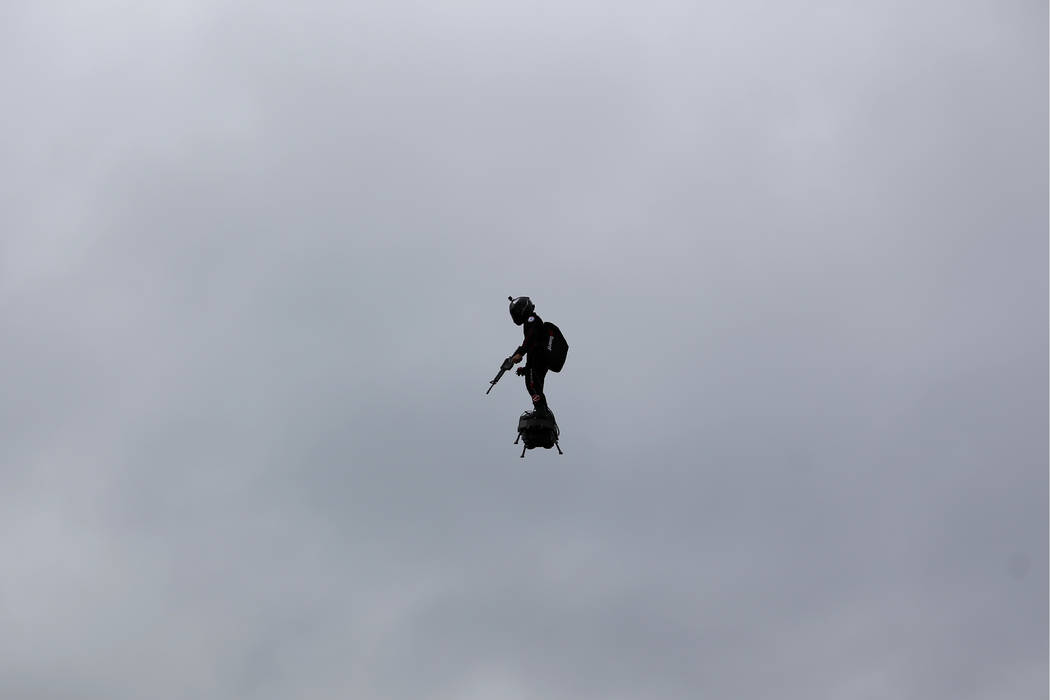 A French soldier on a hoverboard is pictured during Bastille Day parade Sunday, July 14, 2019 o ...