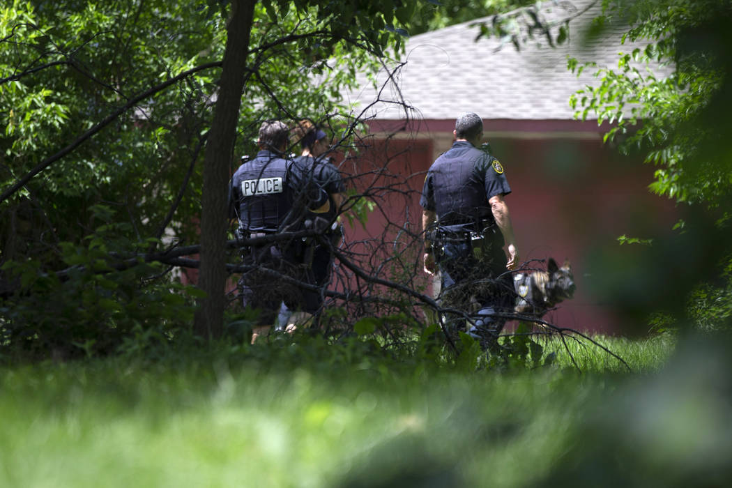 Milwaukee Police officers search a lot in Milwaukee in the 1600 north block of 26th Street Satu ...