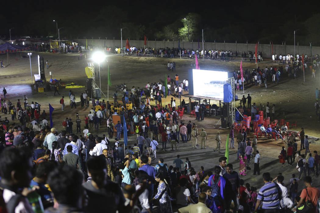 Spectators leave after the Chandrayaan-2 mission was aborted at Sriharikota, in southern India, ...