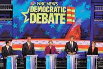 Democratic presidential candidate Sen. Elizabeth Warren, D-Mass., center, answers a question, d ...