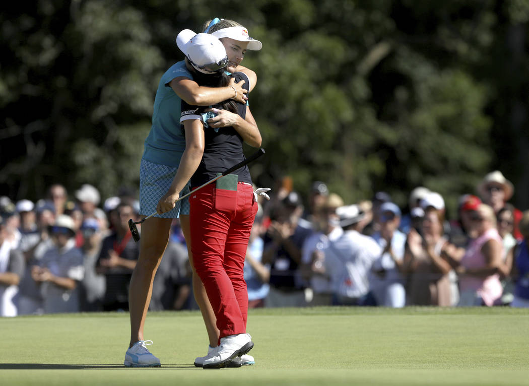 Winner Sei Young Kim is hugged by runner-up Lexi Thompson on No. 18, after the final round of t ...