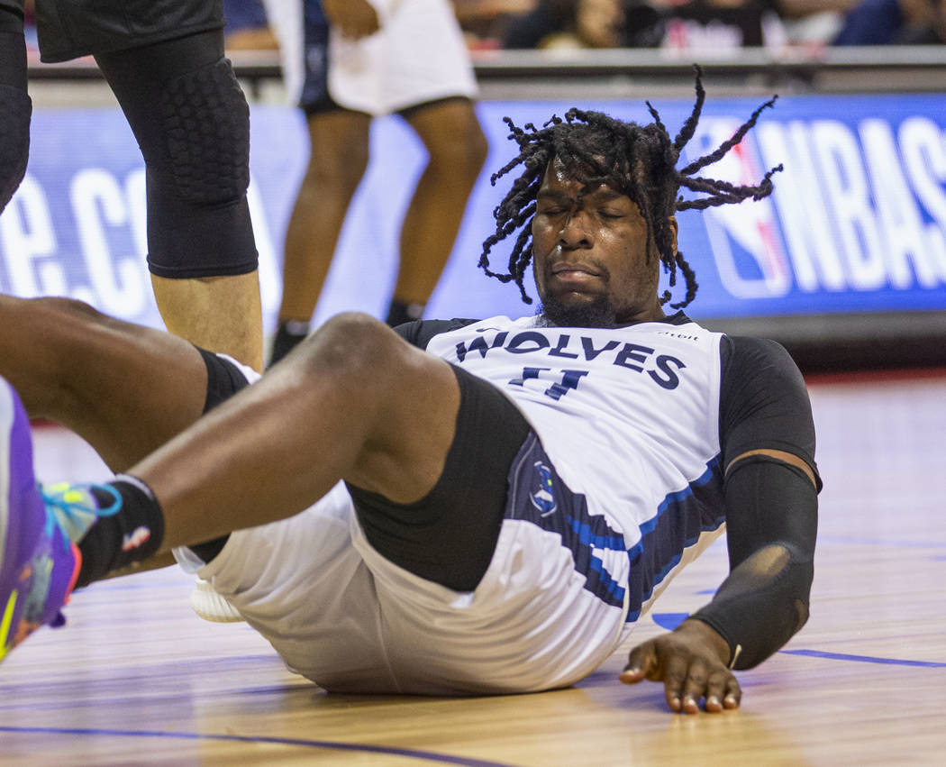 Minnesota Timberwolves center Naz Reid crashes to the court versus the Brooklyn Nets during the ...