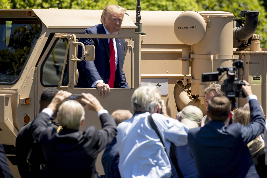 President Donald Trump gets out of the driver's seat of Lockeed Martin's Terminal High Altitude ...