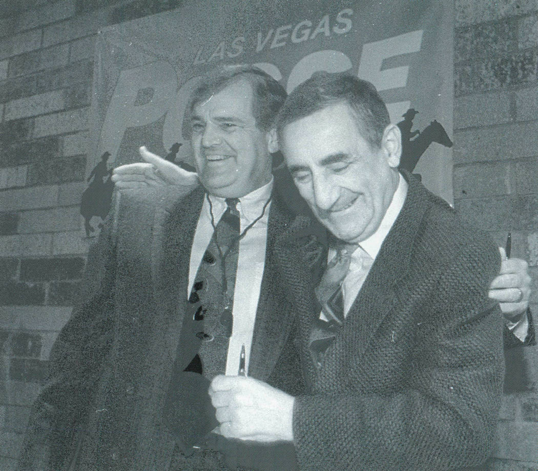 Las Vegas Posse head coach Ron Meyer, left, and owner Nick Mileti embrace during a news confere ...