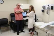 In this July 9, 2019 photo, Dr. Jori Fleisher, neurologist, examines Thomas Doyle, 66, at the R ...