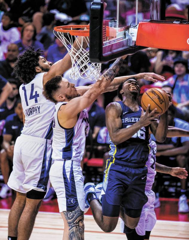 Minnesota Timberwolves forward Jordan Murphy, left, and Minnesota Timberwolves forward Mitch Cr ...