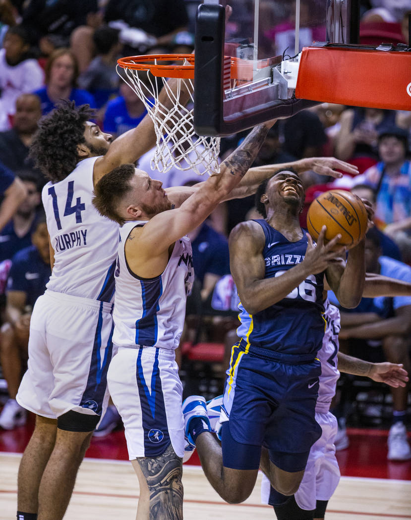 Minnesota Timberwolves forward Jordan Murphy, left, and Minnesota Timberwolves forward Mitch Cr ...