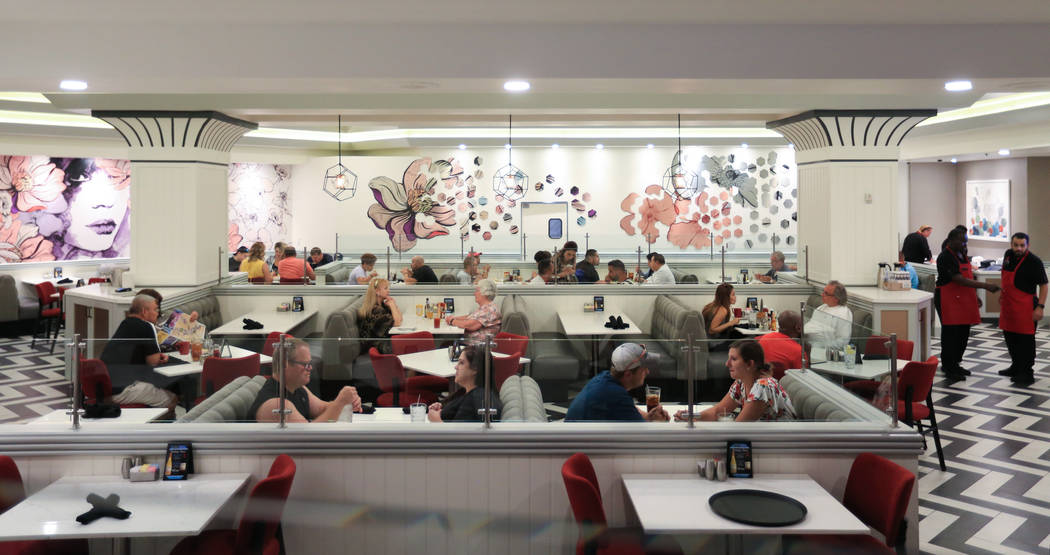 Diners enjoy a meal at the Strat Cafe, a new eatery opened as part of renovations to the Strat ...