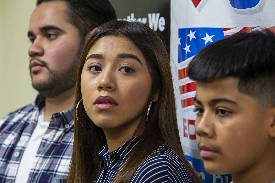 Omar Arellano Cruz, 21, left, Kimberly Arellano Cruz, 16, and AJ Arellano Cruz, 12, listen in a ...