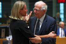 European Union foreign policy chief Federica Mogherini, left, talks to Spain's Foreign Minister ...
