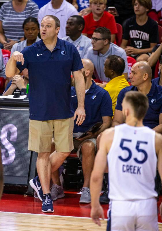 Memphis Grizzlies head coach Taylor Jenkins calls in another play versus the Minnesota Timberwo ...