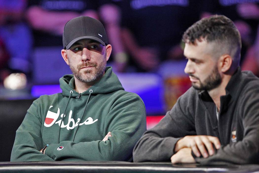 Garry Gates, left, and Alex Livingston, right, on the second day of the main event final table ...