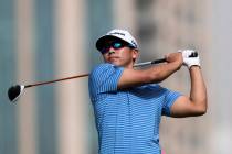 Kurt Kitayama of the U.S. tees off on the 5th hole during round one of the Dubai Desert Classic ...