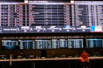 A gambler places a bet at the new sportsbook at Bally's casino in Atlantic City, N.J. on June 2 ...