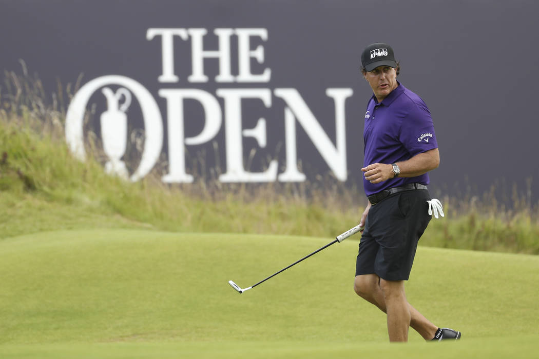 Phil Mickelson of the United States walks on the 18th green during a practice round ahead of th ...