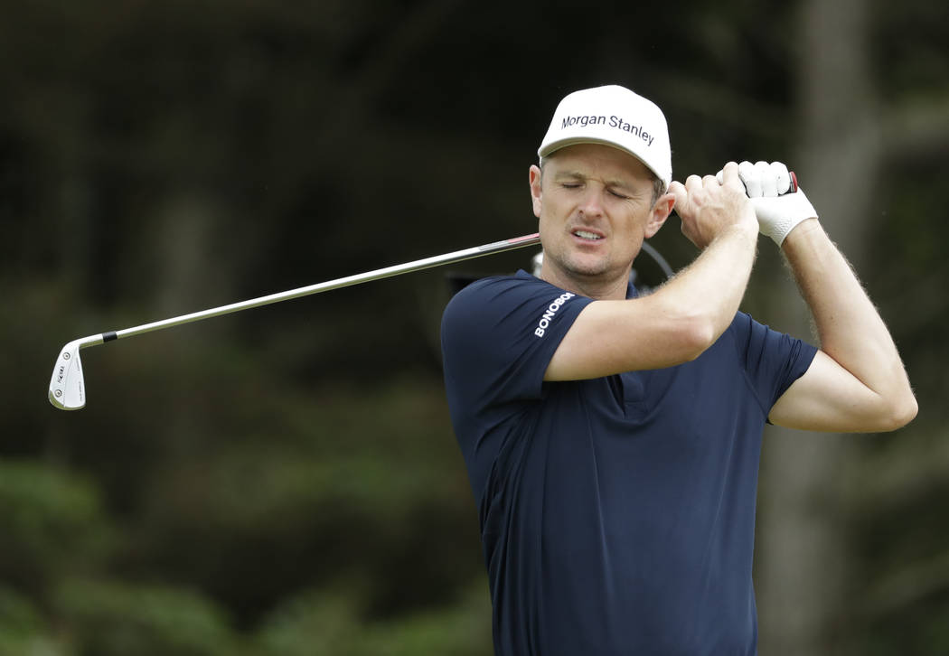England's Justin Rose reacts after playing his second the shot from the 5th during a practice r ...