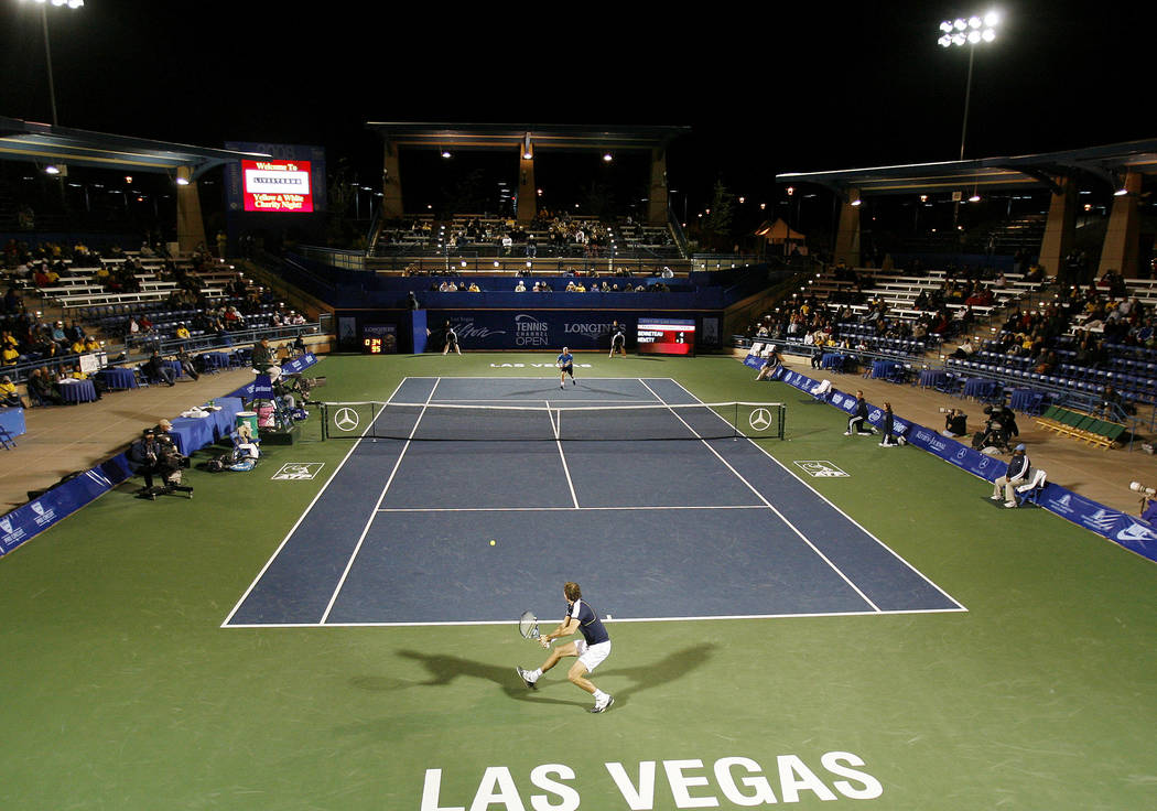 Julien Benneteau, of France, hits a return versus Lleyton Hewitt, of Australia, during the seco ...