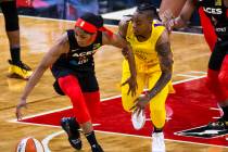 Las Vegas Aces guard Sydney Colson (51) steals the ball from Los Angeles Sparks guard Riquna Wi ...