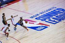 Atlanta Hawks' Tahjre McCall (8) brings the ball up court past Washington Wizards' Justin Robin ...